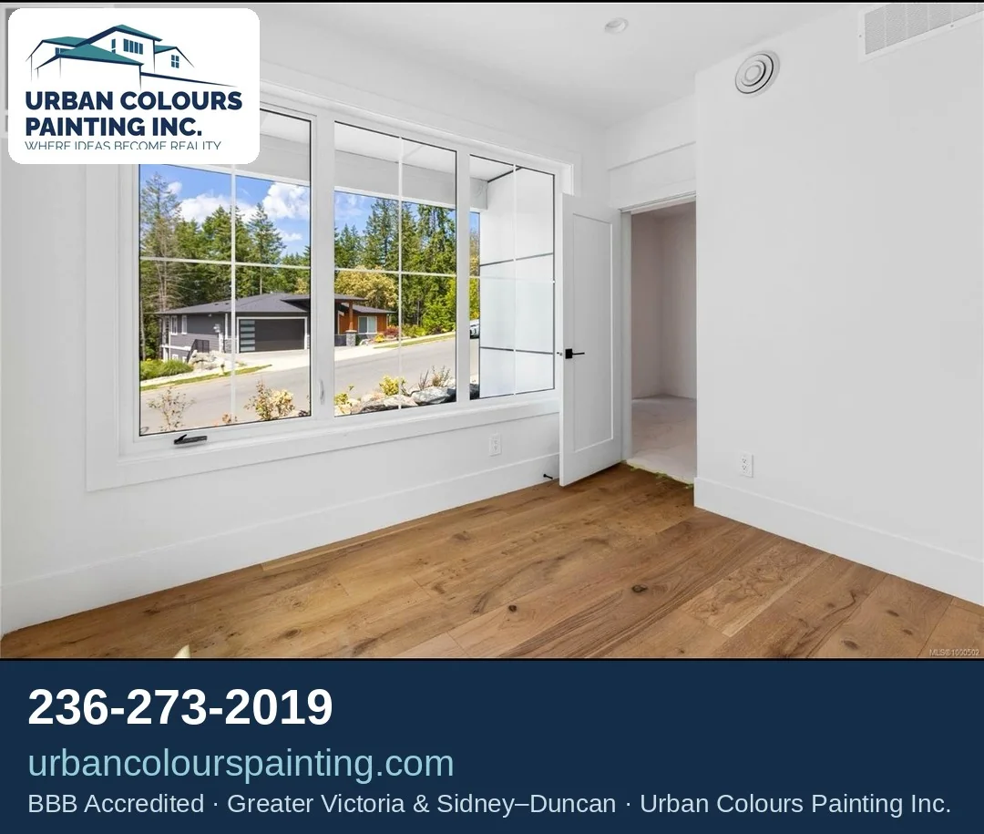 Finished bright interior room with painted walls and large windows
